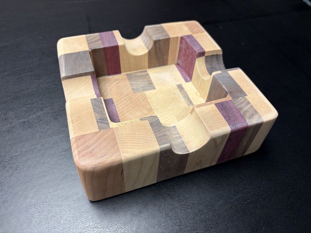 Handcrafted square cigar ashtray with contrasting hardwood blocks, a recessed center, and four cigar rests